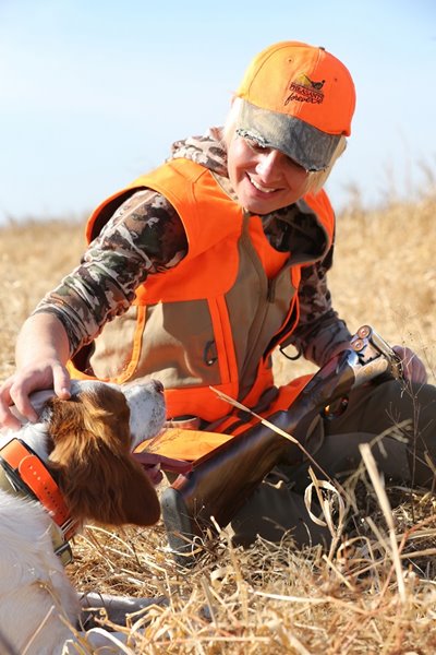 Christine Cunningham shares a moment of rest with her bird dog and the Syren Elos Venti.