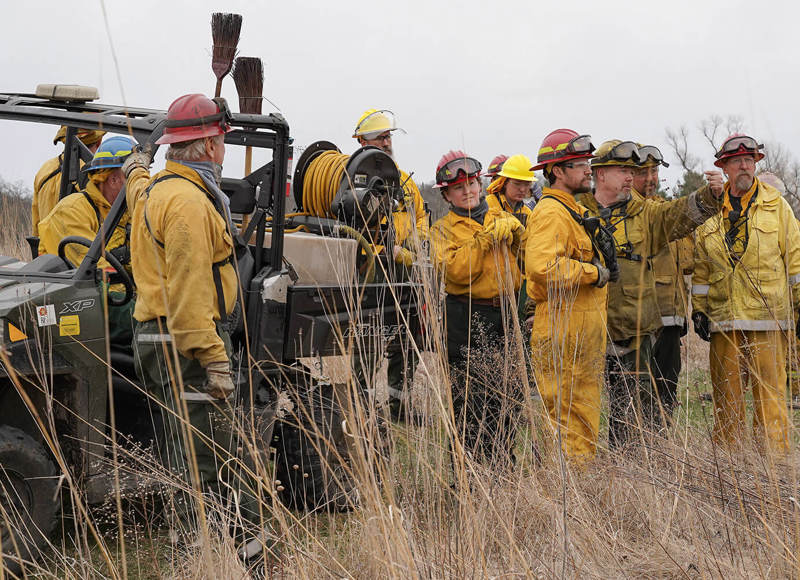 Workers with helmets in field 