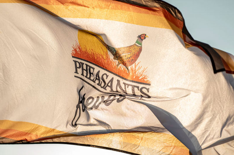 Flag with Pheasants Forever logo on it